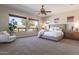 Spacious main bedroom featuring a large bed, windows, and carpet floors at 5626 E Sleepy Ranch Rd, Cave Creek, AZ 85331