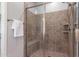 Close-up of a tiled shower with a glass door and a built-in shower bench at 5626 E Sleepy Ranch Rd, Cave Creek, AZ 85331