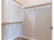 Walk-in closet with wood racks and shelves for storage at 5626 E Sleepy Ranch Rd, Cave Creek, AZ 85331