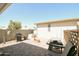 Small backyard with grill and patio furniture at 5735 E Mcdowell Rd # 38, Mesa, AZ 85215