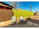 Relaxing backyard patio with seating and desert landscaping at 59 N Adams St, Wickenburg, AZ 85390