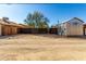 Large backyard with gravel, shed and wooden fence at 59 N Adams St, Wickenburg, AZ 85390