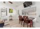 Small dining area with a table and chairs near a large window, providing a bright space at 59 N Adams St, Wickenburg, AZ 85390