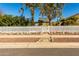 White picket fence and walkway leading to house at 59 N Adams St, Wickenburg, AZ 85390