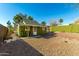 Green house with a side yard and stone pathway at 59 N Adams St, Wickenburg, AZ 85390