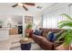 Living room with brown sectional, showcasing an open floor plan with kitchen view at 59 N Adams St, Wickenburg, AZ 85390