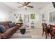 Bright living room with a brown sofa, creating a cozy and inviting atmosphere at 59 N Adams St, Wickenburg, AZ 85390