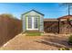 Metal storage shed with double doors in backyard at 59 N Adams St, Wickenburg, AZ 85390