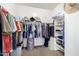 Large walk-in closet with ample shelving and hanging space at 5902 W Gambit Trl, Phoenix, AZ 85083