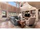 Spacious living room with built-in shelving and large windows at 5902 W Gambit Trl, Phoenix, AZ 85083