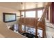 High-ceiling living room with large windows and wooden accents at 5902 W Gambit Trl, Phoenix, AZ 85083