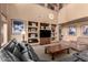 Spacious living room with built-in shelving and large windows at 5902 W Gambit Trl, Phoenix, AZ 85083