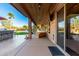 Covered patio with outdoor seating and a view of the pool at 5902 W Gambit Trl, Phoenix, AZ 85083