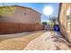 Side yard with gravel, brick pavers, and gated access at 5902 W Gambit Trl, Phoenix, AZ 85083