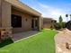 A covered patio and artificial grass provide a nice outdoor area in this home at 6202 E Mckellips Rd # 83, Mesa, AZ 85215