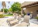 Relaxing backyard patio with lounge chairs, BBQ grill, and putting green at 6202 E Mckellips Rd # 83, Mesa, AZ 85215