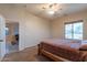 Bedroom with ceiling fan and view of backyard at 6202 E Mckellips Rd # 83, Mesa, AZ 85215