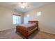 Bright bedroom with carpeted floor, double window, and ceiling fan at 6202 E Mckellips Rd # 83, Mesa, AZ 85215