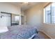 Bedroom with mirrored closet doors and window at 6202 E Mckellips Rd # 83, Mesa, AZ 85215