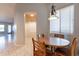 Cozy dining area with wood table and chairs near kitchen at 6202 E Mckellips Rd # 83, Mesa, AZ 85215