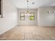 Bright dining room featuring tile flooring and large windows that let in natural light at 6202 E Mckellips Rd # 83, Mesa, AZ 85215