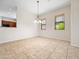 Open dining area with views to the kitchen, tile flooring, and ample natural light at 6202 E Mckellips Rd # 83, Mesa, AZ 85215