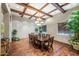 Elegant dining room with a large table and wood flooring at 6202 E Mckellips Rd # 83, Mesa, AZ 85215