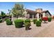 Well-maintained landscaping surrounds this beautiful home at 6202 E Mckellips Rd # 83, Mesa, AZ 85215