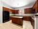 Modern kitchen with granite countertops, an island, stainless steel appliances, and stylish cabinets, ideal for cooking at 6202 E Mckellips Rd # 83, Mesa, AZ 85215