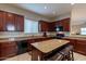 Open kitchen with granite island and stainless steel appliances at 6202 E Mckellips Rd # 83, Mesa, AZ 85215