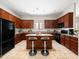 Well-lit kitchen with an island and granite countertops offers a stylish and functional cooking space at 6202 E Mckellips Rd # 83, Mesa, AZ 85215