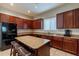 Kitchen with granite countertops and dark wood cabinetry at 6202 E Mckellips Rd # 83, Mesa, AZ 85215