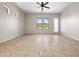 Bright living room with tile floors, a ceiling fan, and plenty of natural light at 6202 E Mckellips Rd # 83, Mesa, AZ 85215