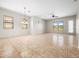 Large, open living room with neutral walls and tile flooring, filled with plenty of natural light at 6202 E Mckellips Rd # 83, Mesa, AZ 85215