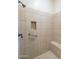 Large tiled shower with built-in seat and grab bar at 6202 E Mckellips Rd # 83, Mesa, AZ 85215