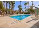 Sparkling community pool with plenty of lounge chairs at 6540 N 7Th Ave # 49, Phoenix, AZ 85013