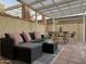 Relaxing patio with covered seating area, wicker furniture, and dining table at 6540 N 7Th Ave # 49, Phoenix, AZ 85013