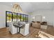 Bright dining area with hardwood floors, modern chandelier, and view of backyard at 6644 E Cholla Dr, Paradise Valley, AZ 85253