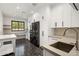 Modern laundry room with ample cabinetry and high-end appliances at 6644 E Cholla Dr, Paradise Valley, AZ 85253