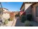 Inviting courtyard entry with a wrought iron gate and bougainvillea at 7701 E Golden Eagle E Cir, Gold Canyon, AZ 85118