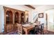 Bright dining area with hardwood floors and a built-in hutch at 7701 E Golden Eagle E Cir, Gold Canyon, AZ 85118