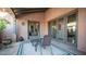 Relaxing outdoor patio with seating area and access from multiple rooms at 7701 E Golden Eagle E Cir, Gold Canyon, AZ 85118