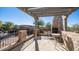 Covered patio with fireplace and seating area at 7701 E Golden Eagle E Cir, Gold Canyon, AZ 85118