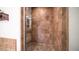 Walk-in shower with glass enclosure and brown tile at 7701 E Golden Eagle E Cir, Gold Canyon, AZ 85118