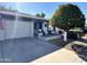 Front view of house with garage and mature orange tree at 7950 E Keats Ave # 170, Mesa, AZ 85209