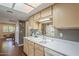 Clean kitchen with light wood cabinets and a double sink at 7950 E Keats Ave # 170, Mesa, AZ 85209