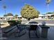 Relaxing patio area with rocking chairs and small table at 7950 E Keats Ave # 170, Mesa, AZ 85209