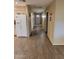 Long hallway with light walls and wood-look flooring at 8020 E Keats Ave # 314, Mesa, AZ 85209