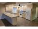 Galley-style kitchen with light wood cabinets and granite countertops at 8020 E Keats Ave # 314, Mesa, AZ 85209