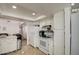 White kitchen with stainless steel appliances and tile floor at 8021 W Charter Oak Rd, Peoria, AZ 85381